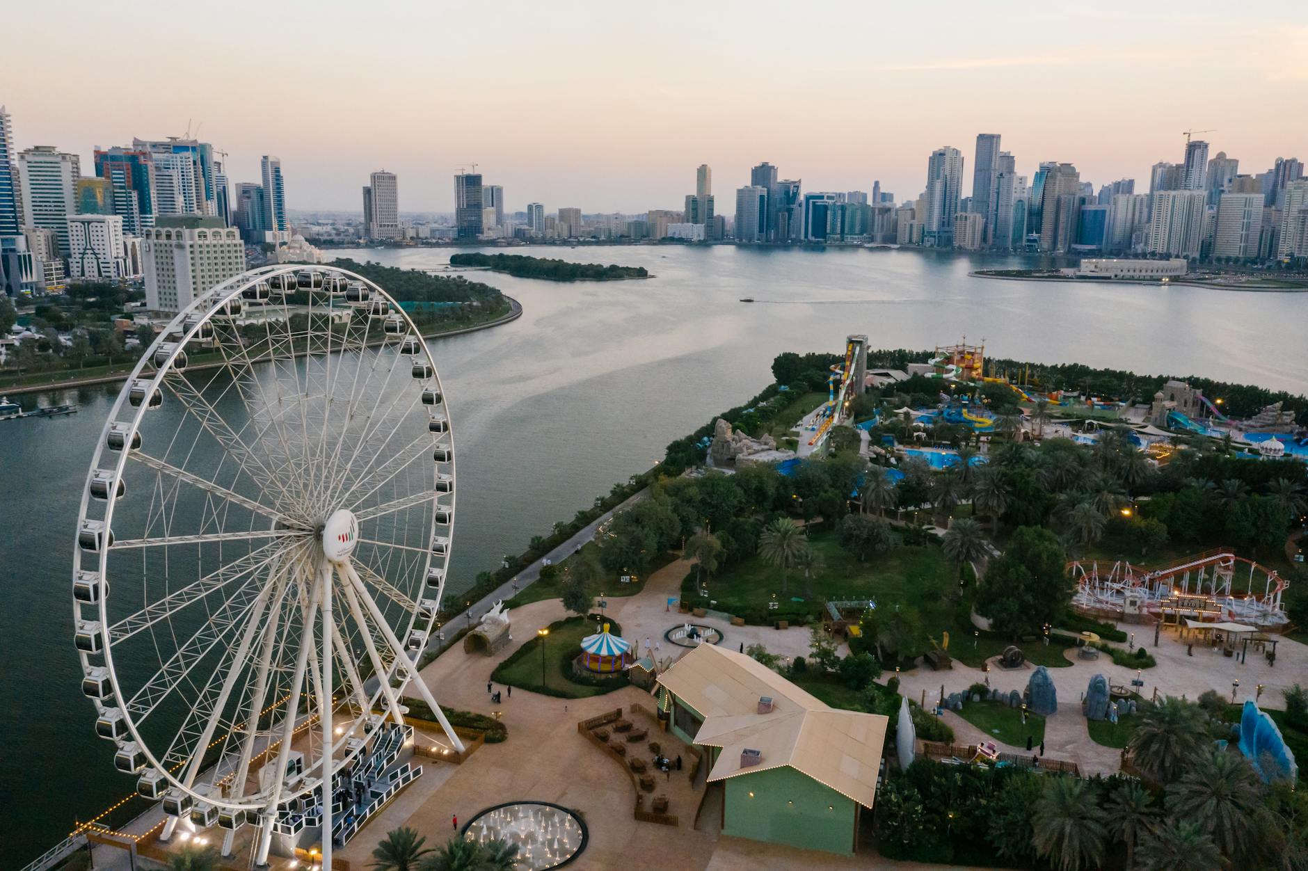 ferris wheel in al montazah parks in sharjah at sunset